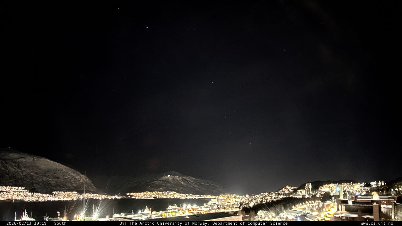 StormCast camera feed showing a cloudy night sky over Tromsø with no aurora visible